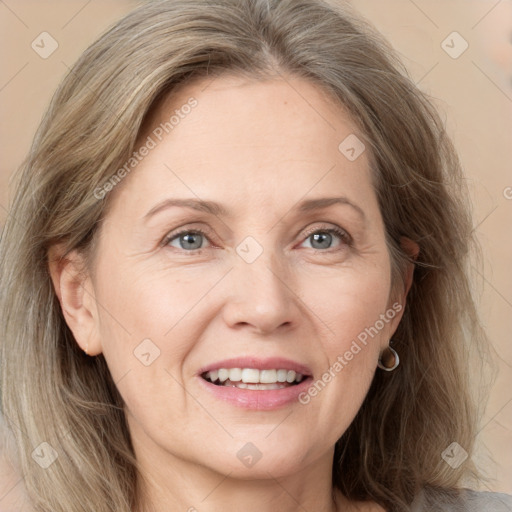 Joyful white adult female with medium  brown hair and grey eyes