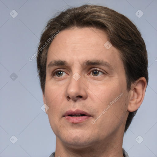 Neutral white adult male with short  brown hair and brown eyes