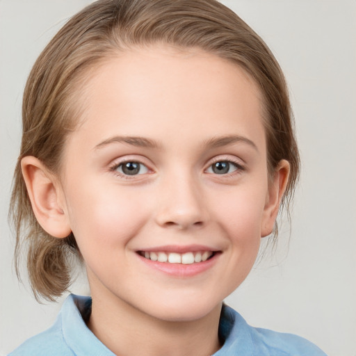 Joyful white child female with medium  brown hair and grey eyes