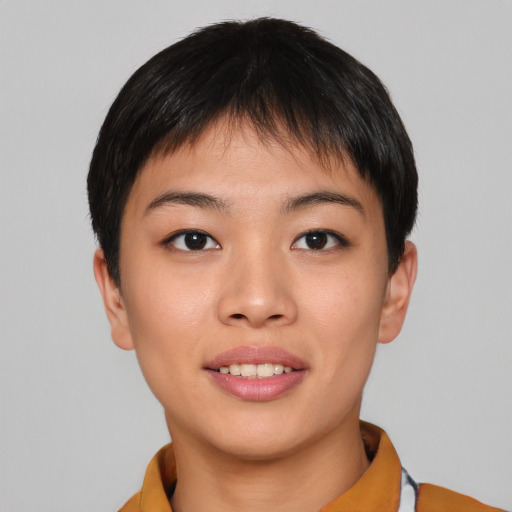 Joyful asian young-adult female with short  black hair and brown eyes