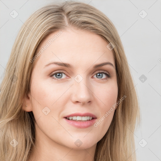 Joyful white young-adult female with long  brown hair and blue eyes