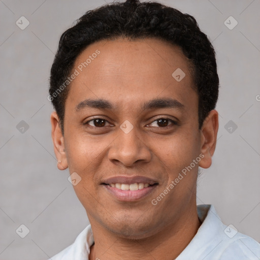 Joyful latino young-adult male with short  black hair and brown eyes