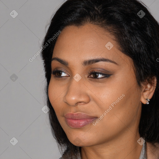 Joyful latino young-adult female with medium  black hair and brown eyes