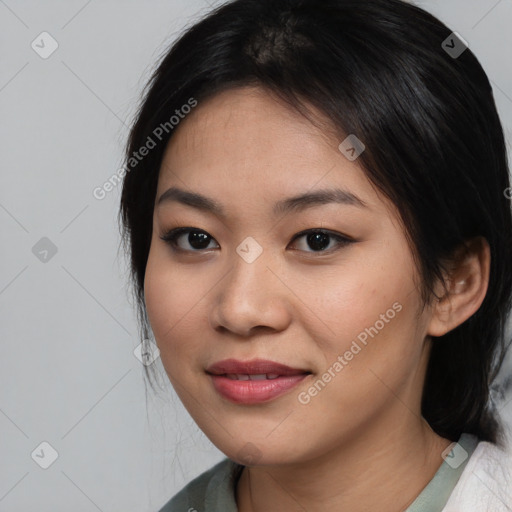 Joyful asian young-adult female with medium  black hair and brown eyes