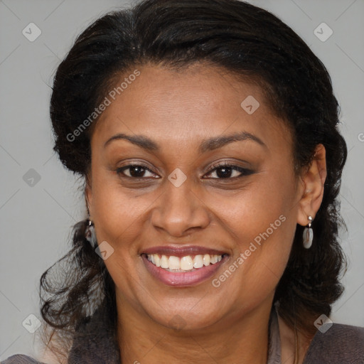 Joyful black adult female with medium  brown hair and brown eyes