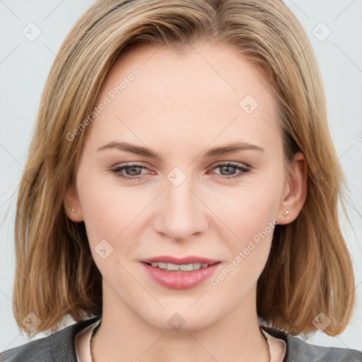 Joyful white young-adult female with medium  brown hair and blue eyes