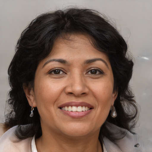 Joyful white adult female with medium  brown hair and brown eyes