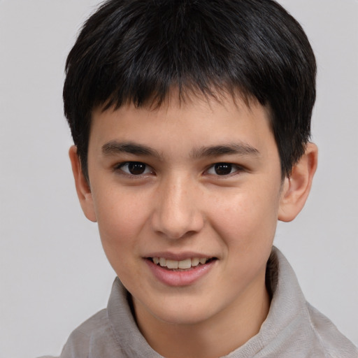 Joyful white child male with short  brown hair and brown eyes