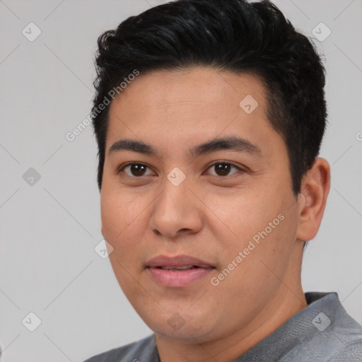 Joyful asian young-adult male with short  black hair and brown eyes