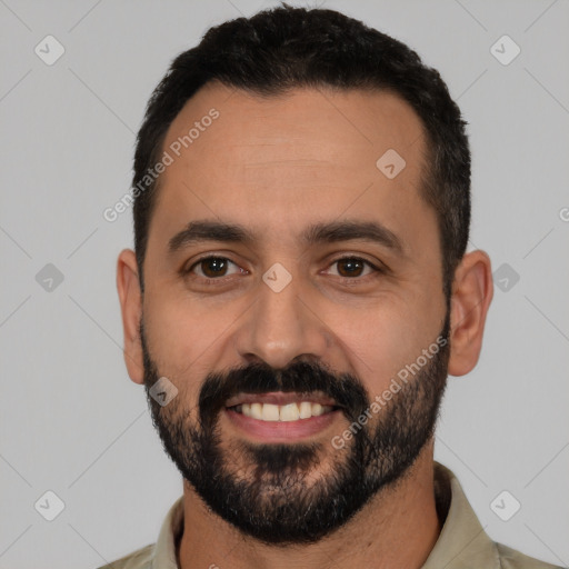 Joyful white young-adult male with short  black hair and brown eyes