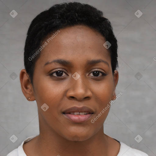 Joyful black young-adult female with short  black hair and brown eyes