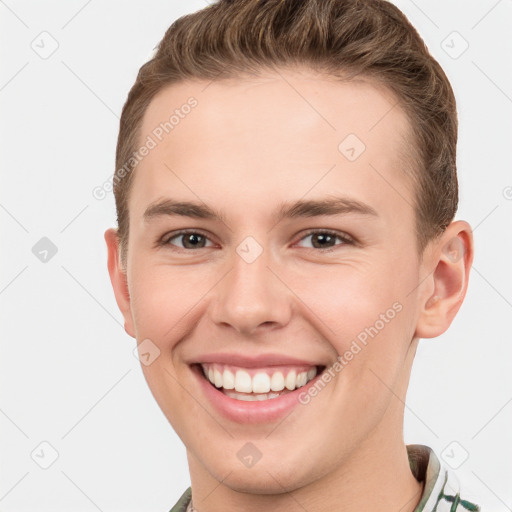 Joyful white young-adult male with short  brown hair and brown eyes