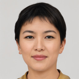 Joyful asian young-adult female with short  black hair and brown eyes