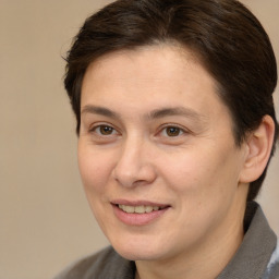 Joyful white adult female with short  brown hair and brown eyes