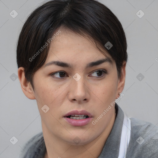 Joyful asian young-adult female with short  brown hair and brown eyes