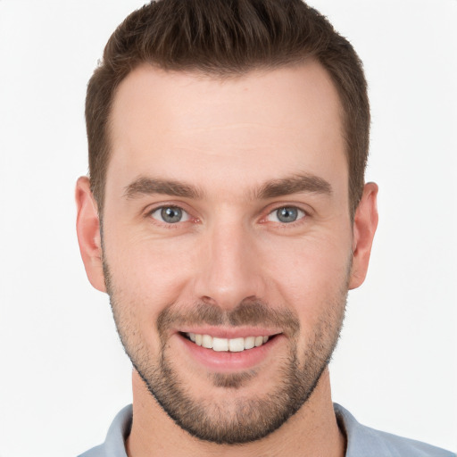 Joyful white young-adult male with short  brown hair and brown eyes