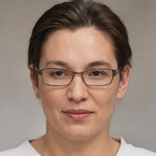 Joyful white adult female with short  brown hair and brown eyes