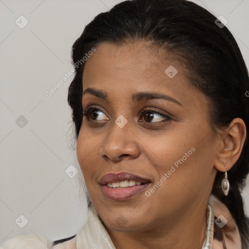 Joyful black young-adult female with medium  brown hair and brown eyes