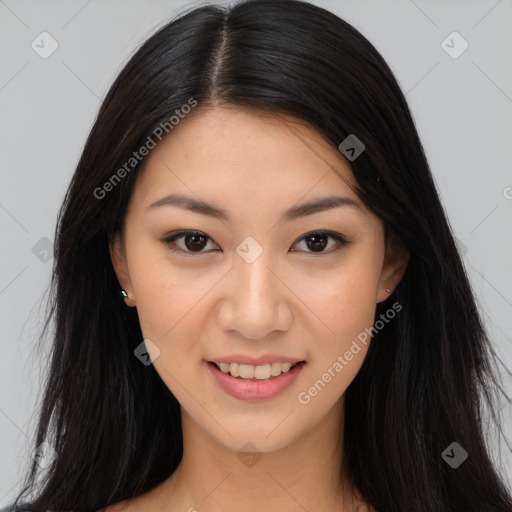 Joyful asian young-adult female with long  brown hair and brown eyes