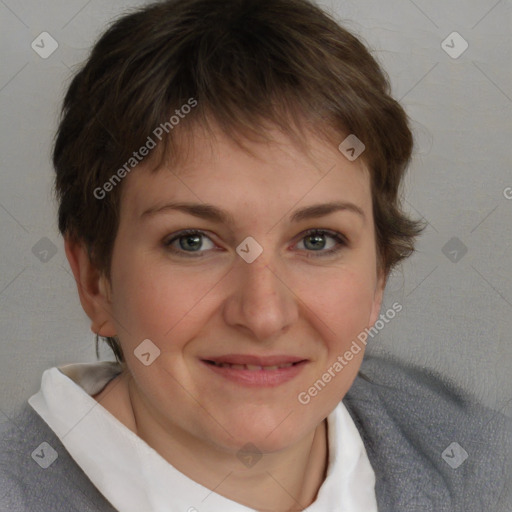 Joyful white young-adult female with short  brown hair and blue eyes