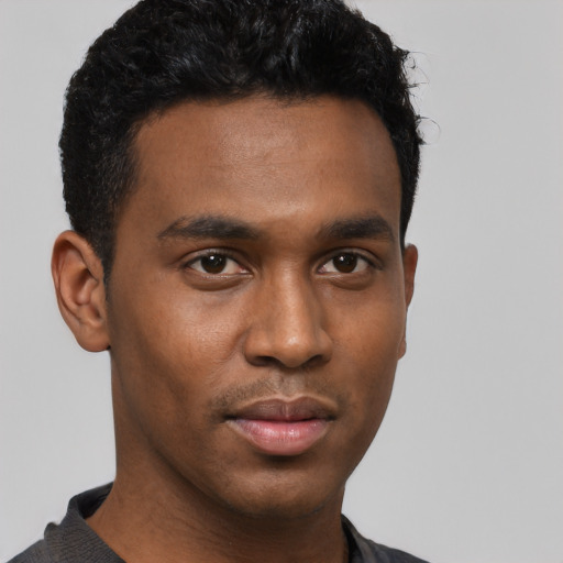 Neutral black young-adult male with short  black hair and brown eyes