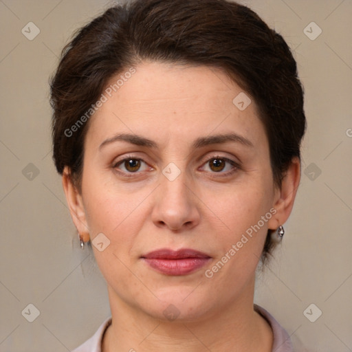 Joyful white adult female with short  brown hair and brown eyes