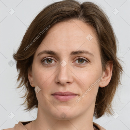 Joyful white young-adult female with medium  brown hair and green eyes