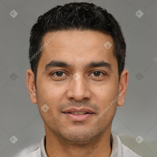 Joyful white young-adult male with short  black hair and brown eyes