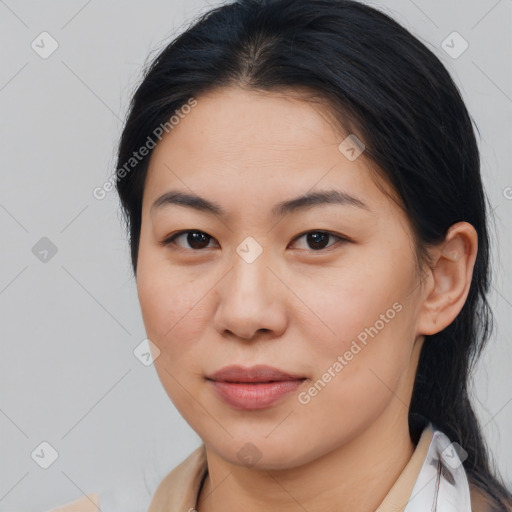 Joyful asian young-adult female with medium  brown hair and brown eyes