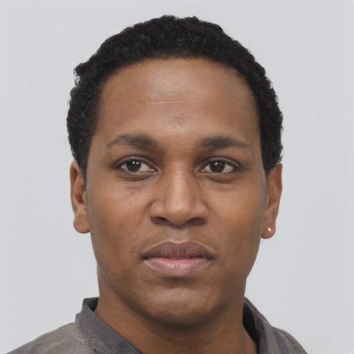 Neutral black young-adult male with short  black hair and brown eyes