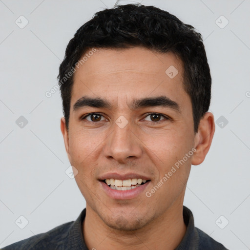 Joyful white young-adult male with short  black hair and brown eyes