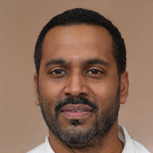 Neutral latino adult male with short  black hair and brown eyes
