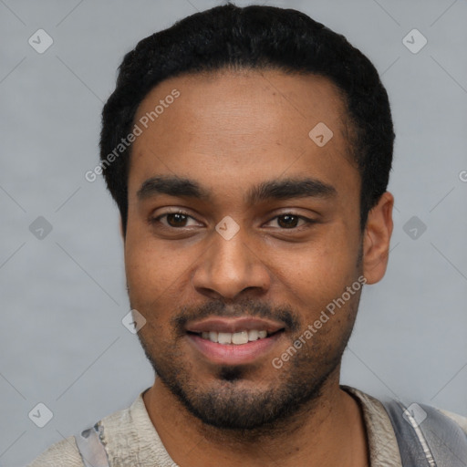 Joyful black young-adult male with short  black hair and brown eyes