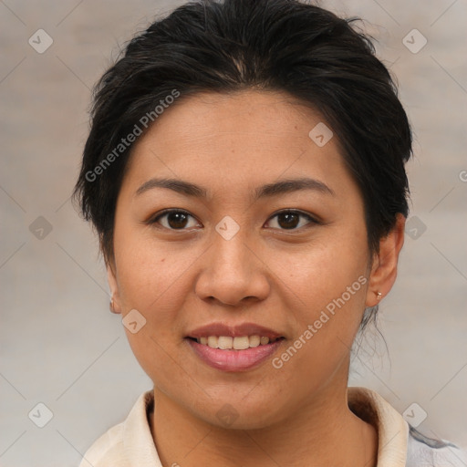 Joyful asian young-adult female with medium  brown hair and brown eyes