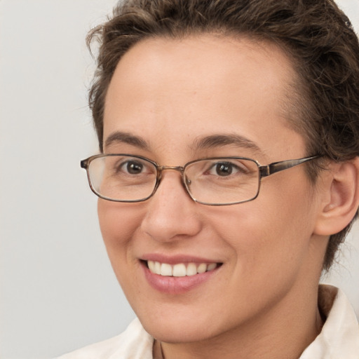 Joyful white adult female with short  brown hair and brown eyes