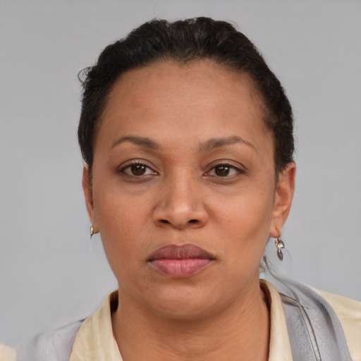 Neutral latino adult female with short  brown hair and brown eyes
