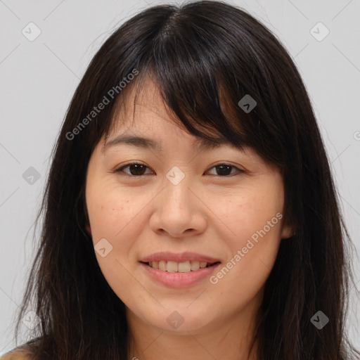 Joyful white young-adult female with long  brown hair and brown eyes