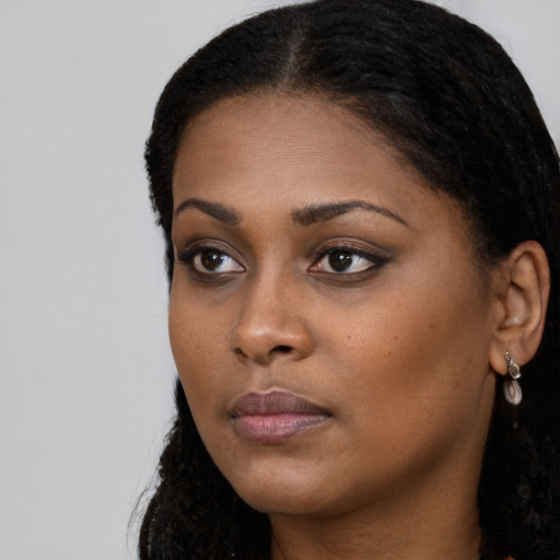 Neutral black young-adult female with long  black hair and brown eyes