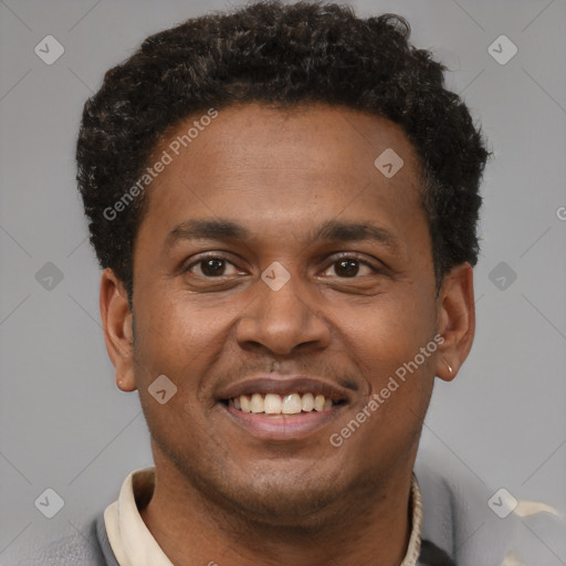 Joyful latino young-adult male with short  brown hair and brown eyes