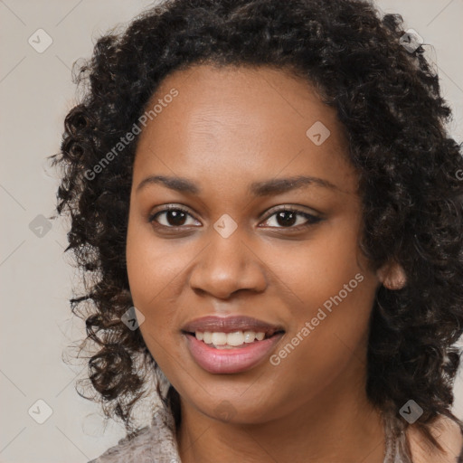 Joyful black young-adult female with long  brown hair and brown eyes