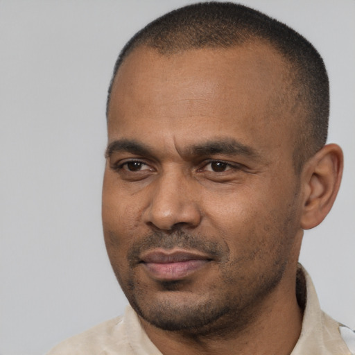 Neutral latino adult male with short  black hair and brown eyes