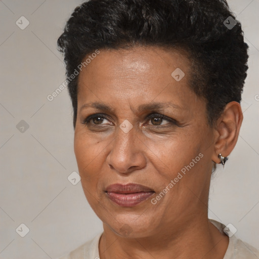 Joyful black adult female with short  brown hair and brown eyes