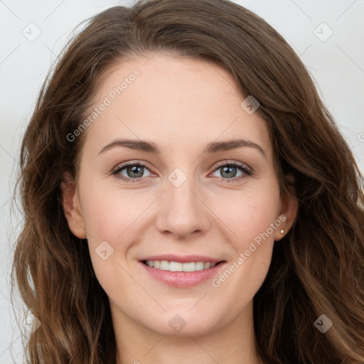 Joyful white young-adult female with long  brown hair and green eyes