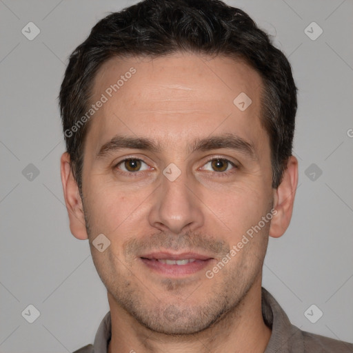 Joyful white adult male with short  brown hair and brown eyes