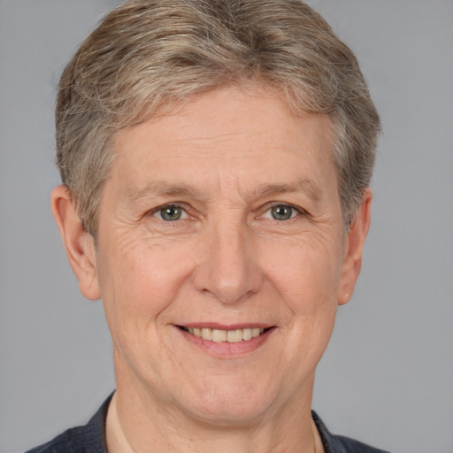 Joyful white middle-aged male with short  brown hair and grey eyes