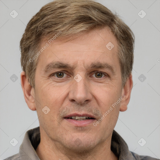 Joyful white adult male with short  brown hair and grey eyes