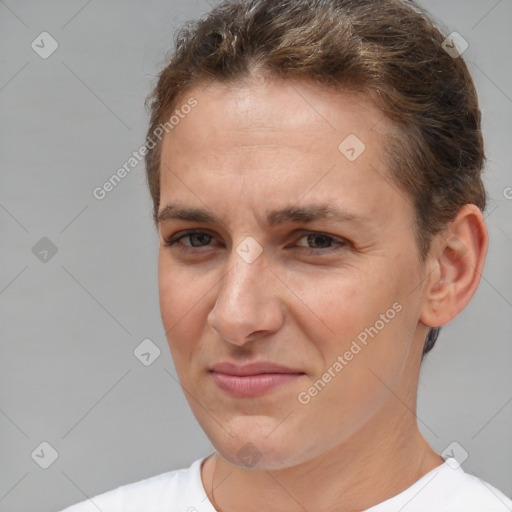 Joyful white adult female with short  brown hair and brown eyes