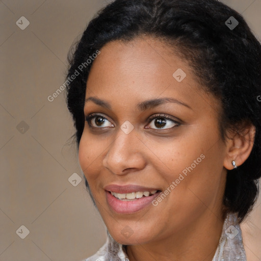 Joyful black young-adult female with medium  brown hair and brown eyes