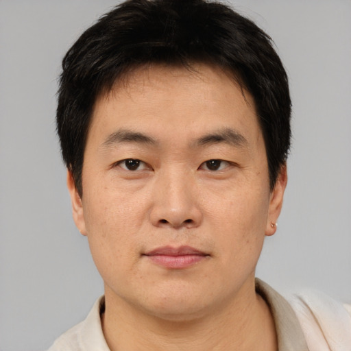 Neutral asian young-adult male with short  brown hair and brown eyes
