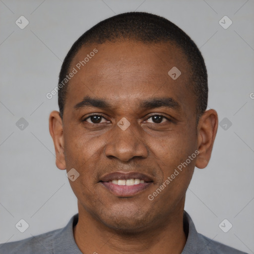 Joyful latino young-adult male with short  brown hair and brown eyes